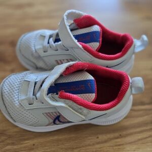 Nike Kids White and Blue Sneakers with Red Accents